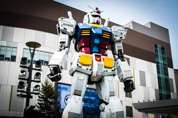 A towering Gundam statue viewed from below
