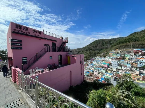 Pink staircases overlooking the colourful hillside houses of Busan
