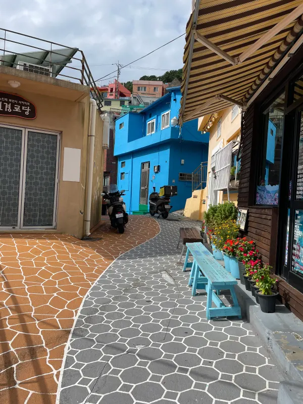A narrow blue and terracotta alley in Gamcheon Culture Village