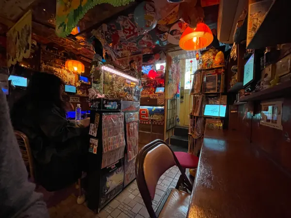 Lanterns and colourful objects in a warmly lit restaurant