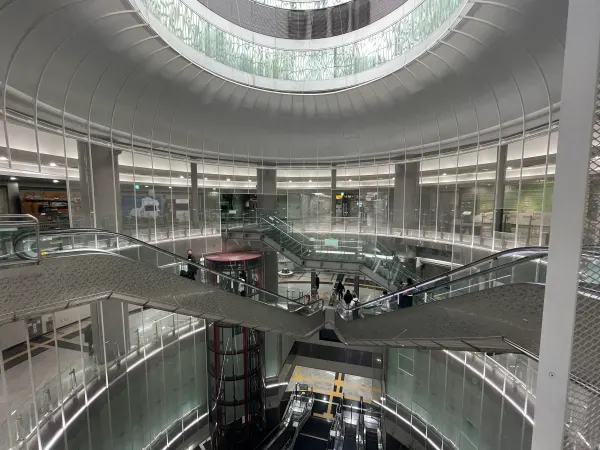Curved balconies and a circular skylight inside a modern building