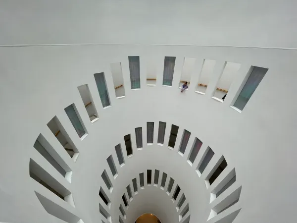 A spiral of white geometric steps viewed from above