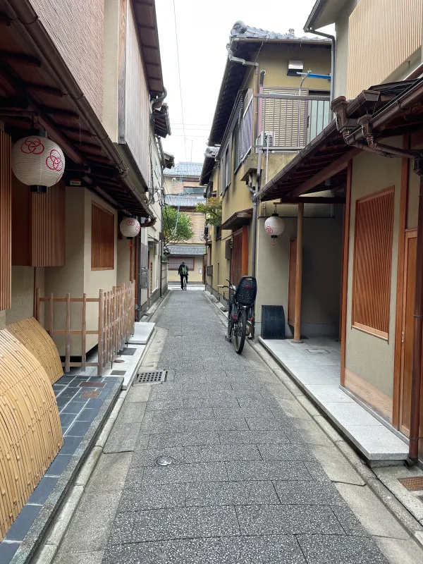 A narrow lane between traditional wooden houses