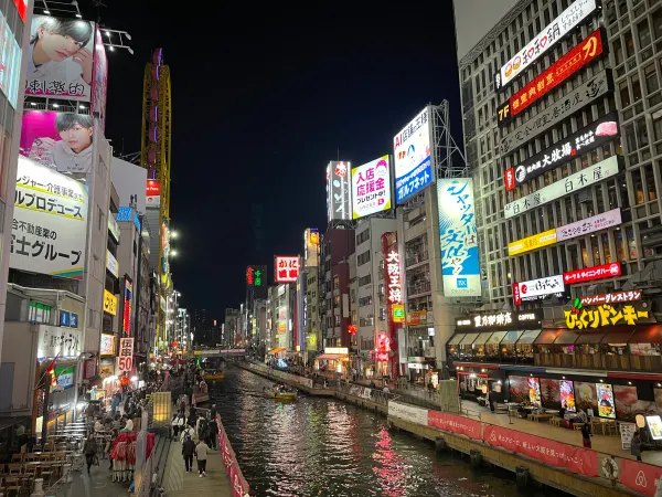 Neon signs reflected in the canal at night