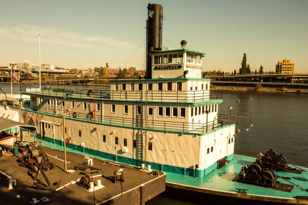 A historic paddle steamer moored on the waterfront