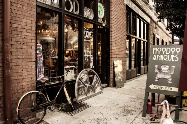 A bicycle outside a brick-fronted shop