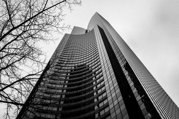 A skyscraper rising into an overcast sky