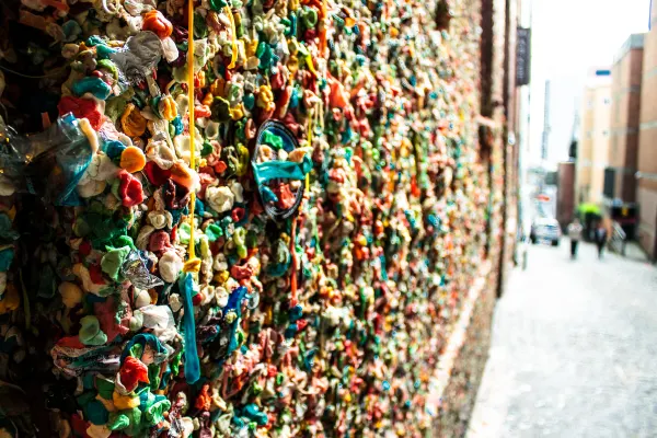 Colourful chewing gum covering a brick wall