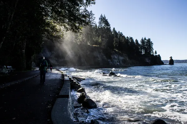 Waves breaking beside the shaded seawall