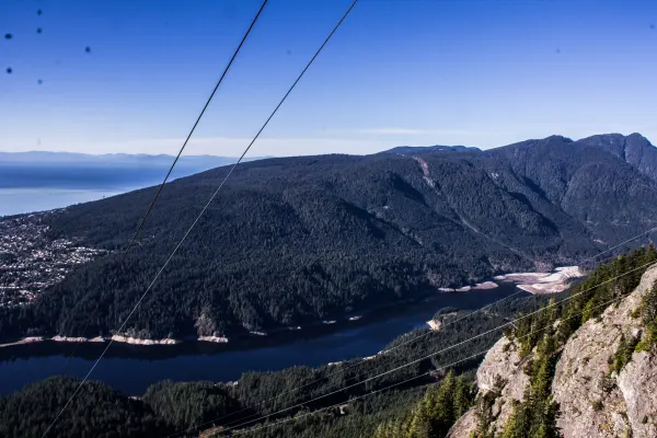 Mountain slopes and a reservoir seen from a cable car