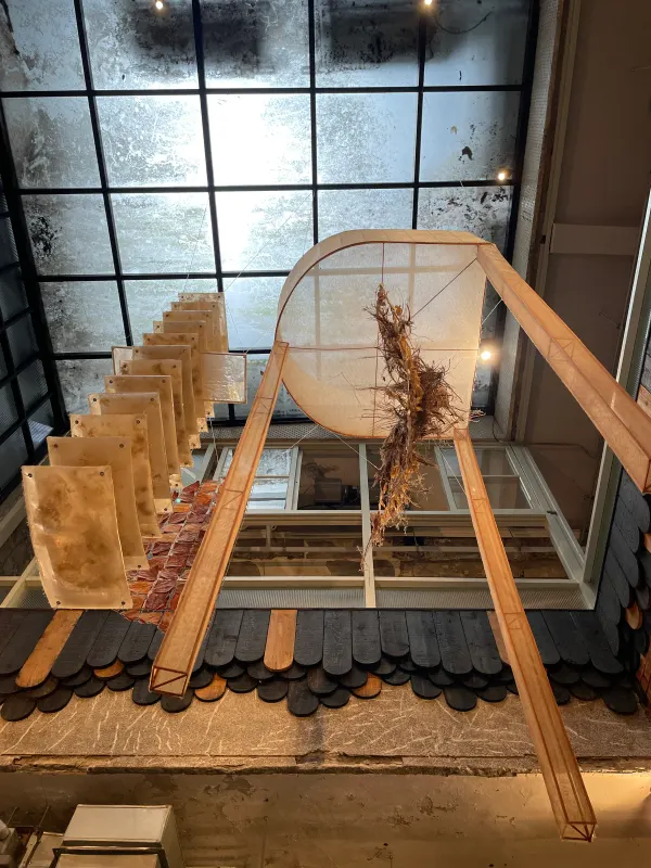A woven chair displayed behind a shop window