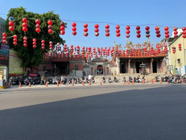 Rows of red lanterns stretching across a temple courtyard