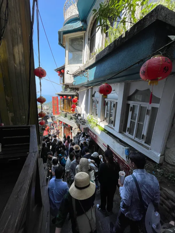 Red lanterns above a crowded stairway in Jiufen